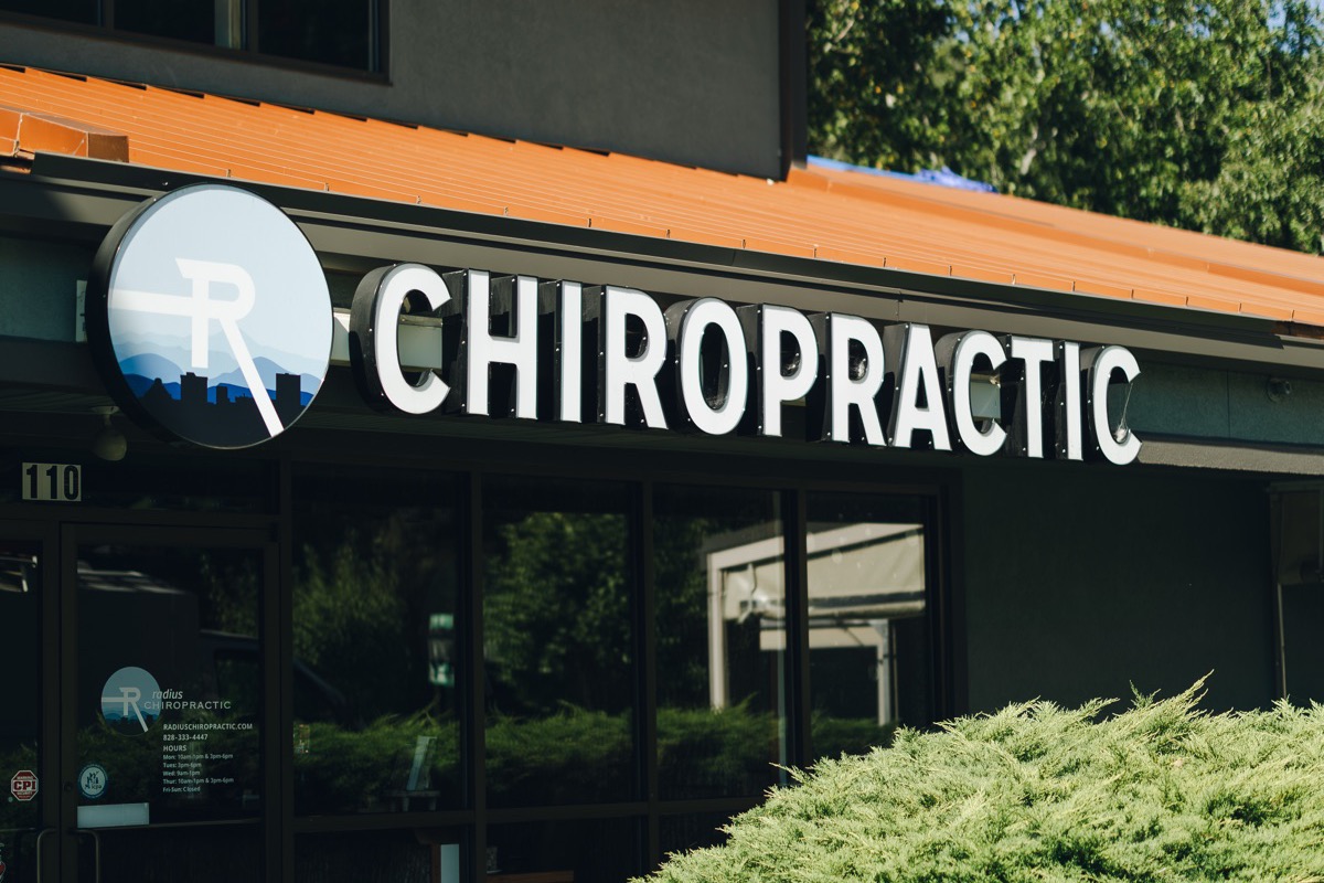 The Radius Chiropractic storefront on Tunnel Road, with the round logo sign over the entrance