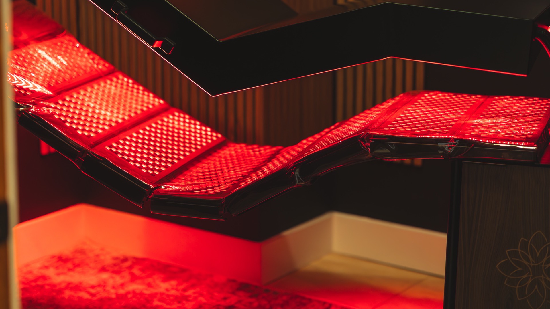 The red light bed at Radius Chiropractic at full glow.