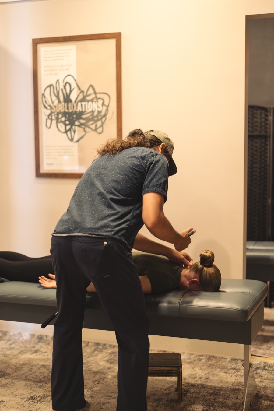 Dr. Dan using the Integrator at the base of a patient's neck