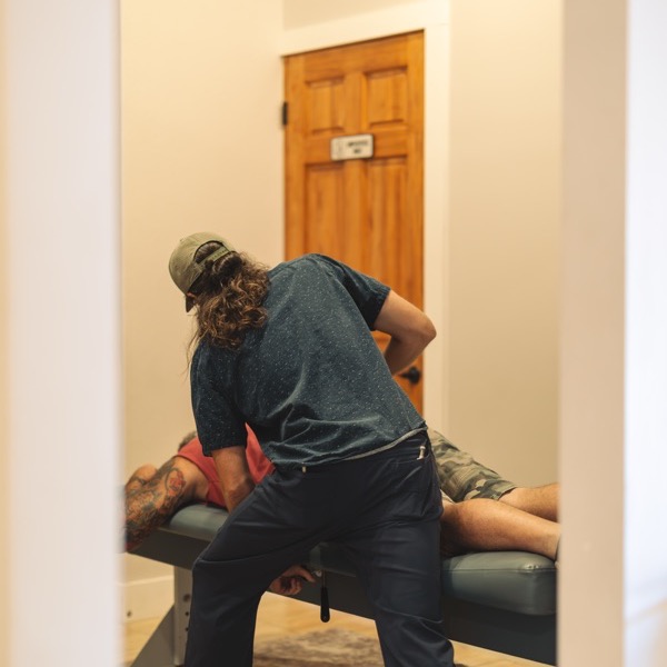 A gentle adjustment at the low back and hip, where sciatica starts