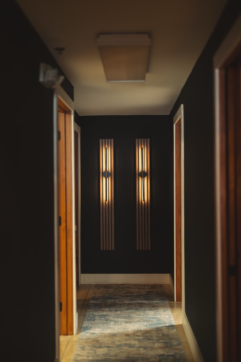 The glow of the red light therapy room from the hallway